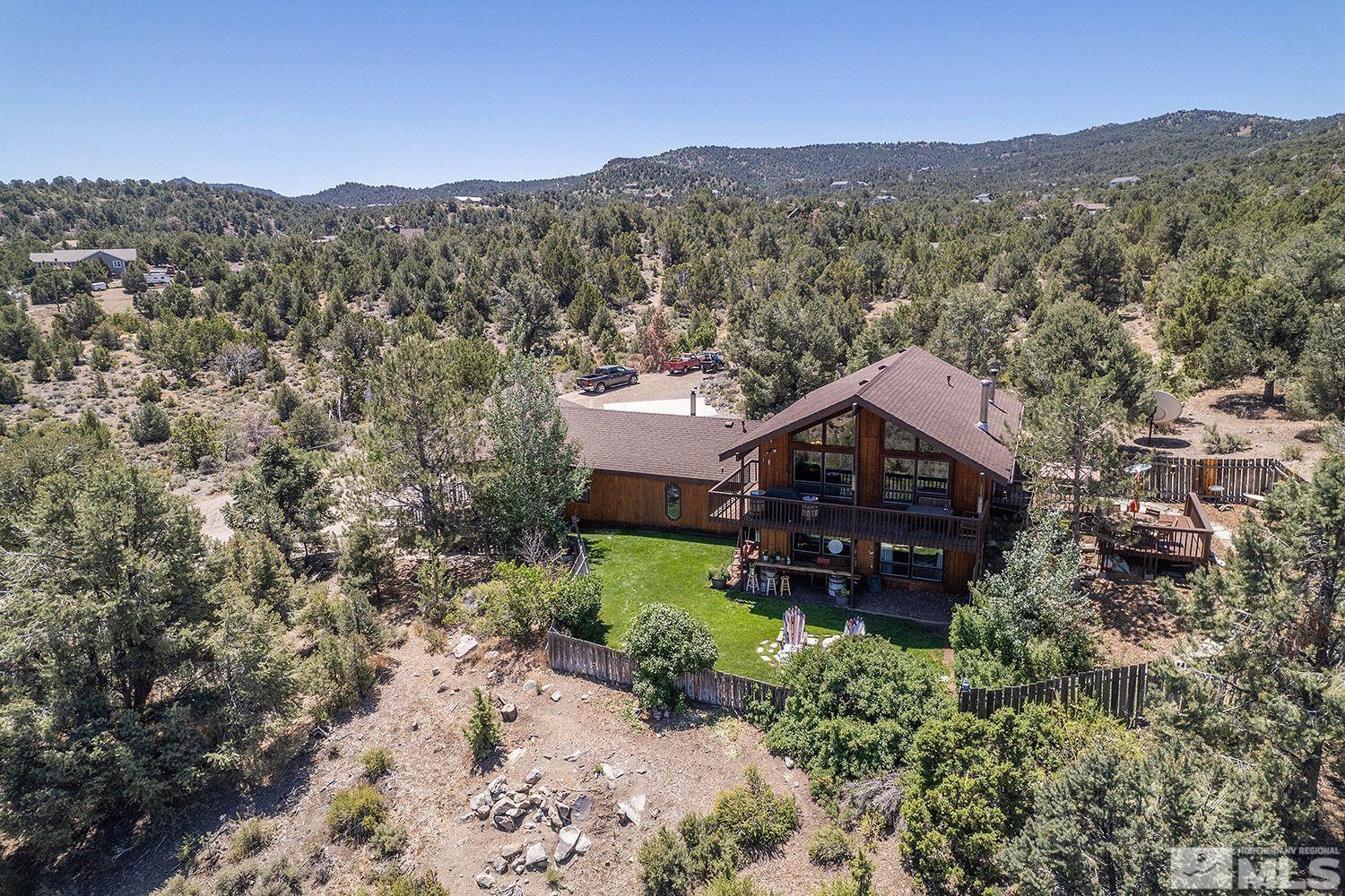 2090 Lousetown Road Reno, NV 89521 - Photo 2 of 30 an aerial view of a house with a mountain in the background