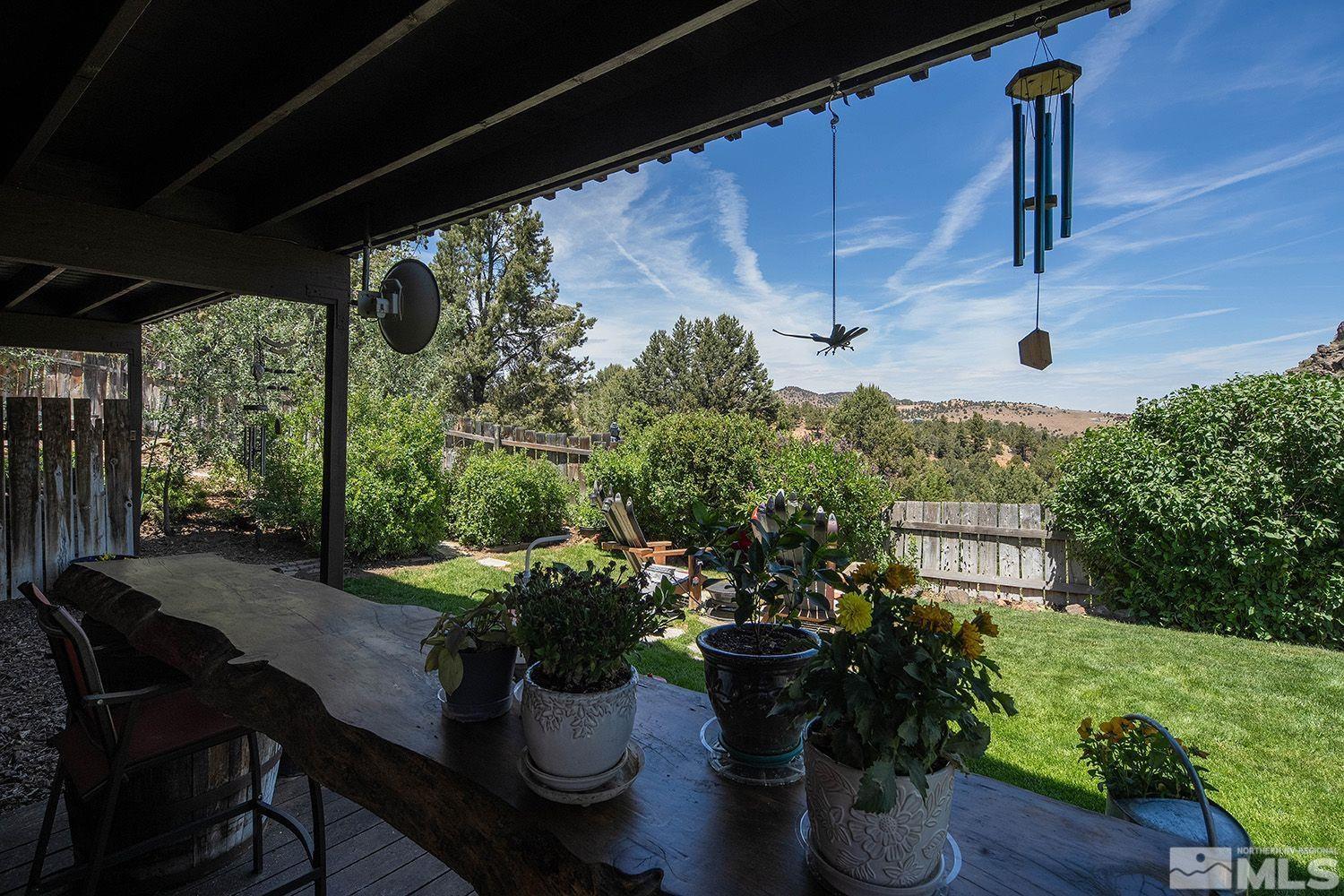 2090 Lousetown Road Reno, NV 89521 - Photo 29 of 30 a view of a porch with furniture and a garden