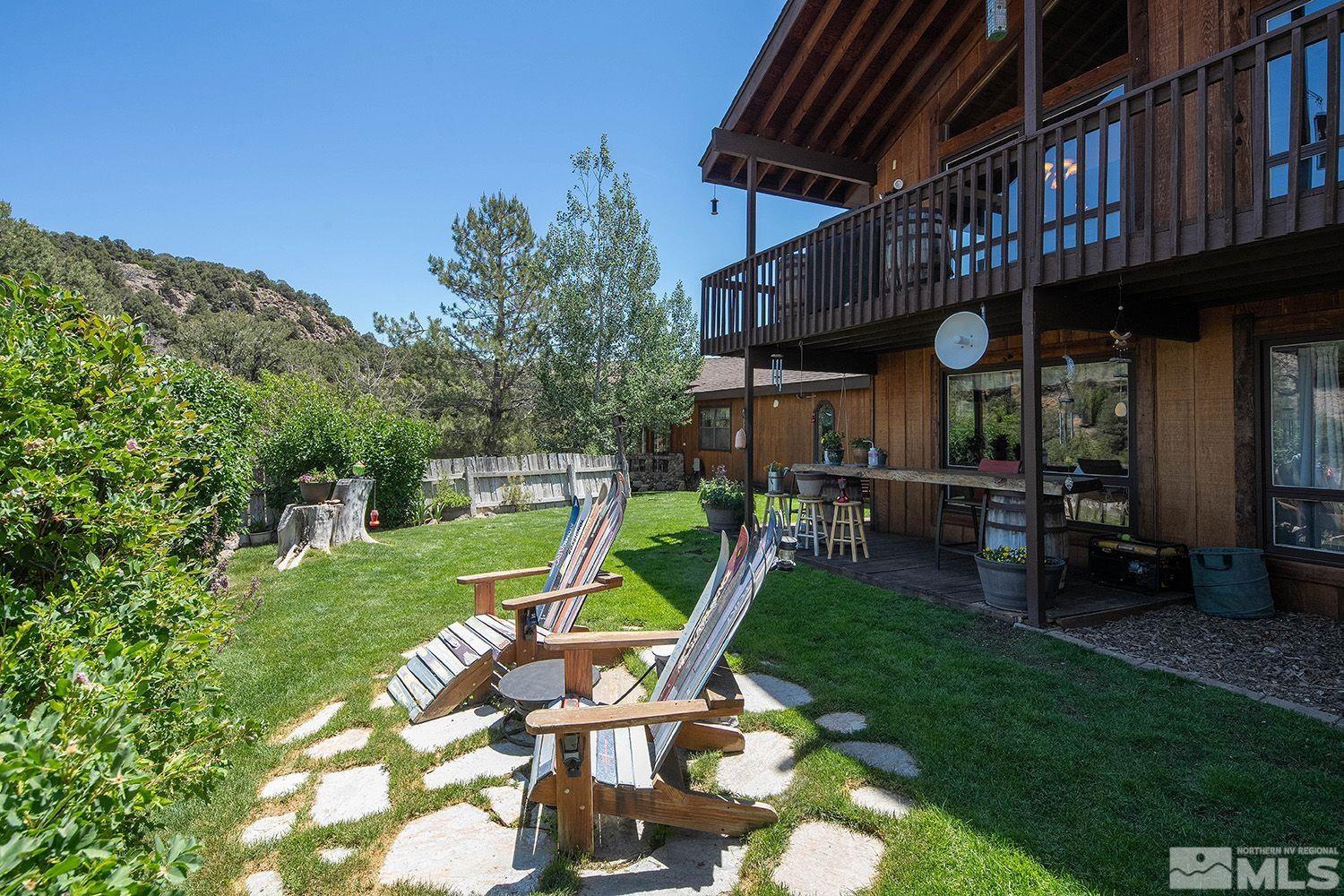 2090 Lousetown Road Reno, NV 89521 - Photo 30 of 30 a view of a chair and table in the backyard