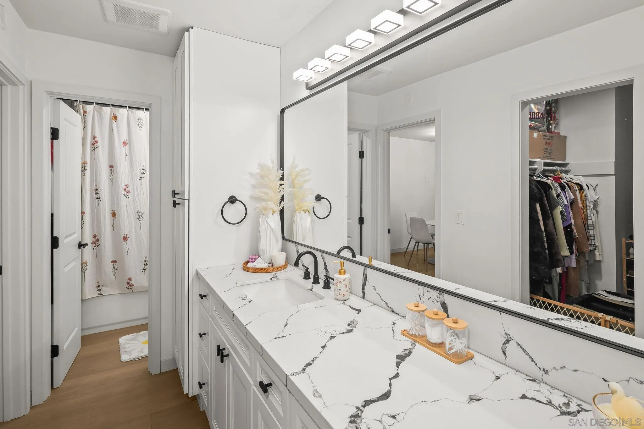 6780 Friars Road, Unit 272 San Diego, CA 92108 - Photo 15 of 35 a bathroom with a double vanity sink mirror and shower