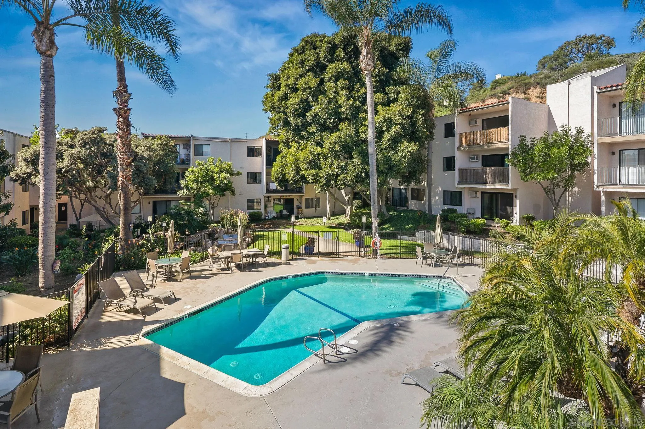6780 Friars Road, Unit 272 San Diego, CA 92108 - Photo 18 of 35 a view of a swimming pool with a patio