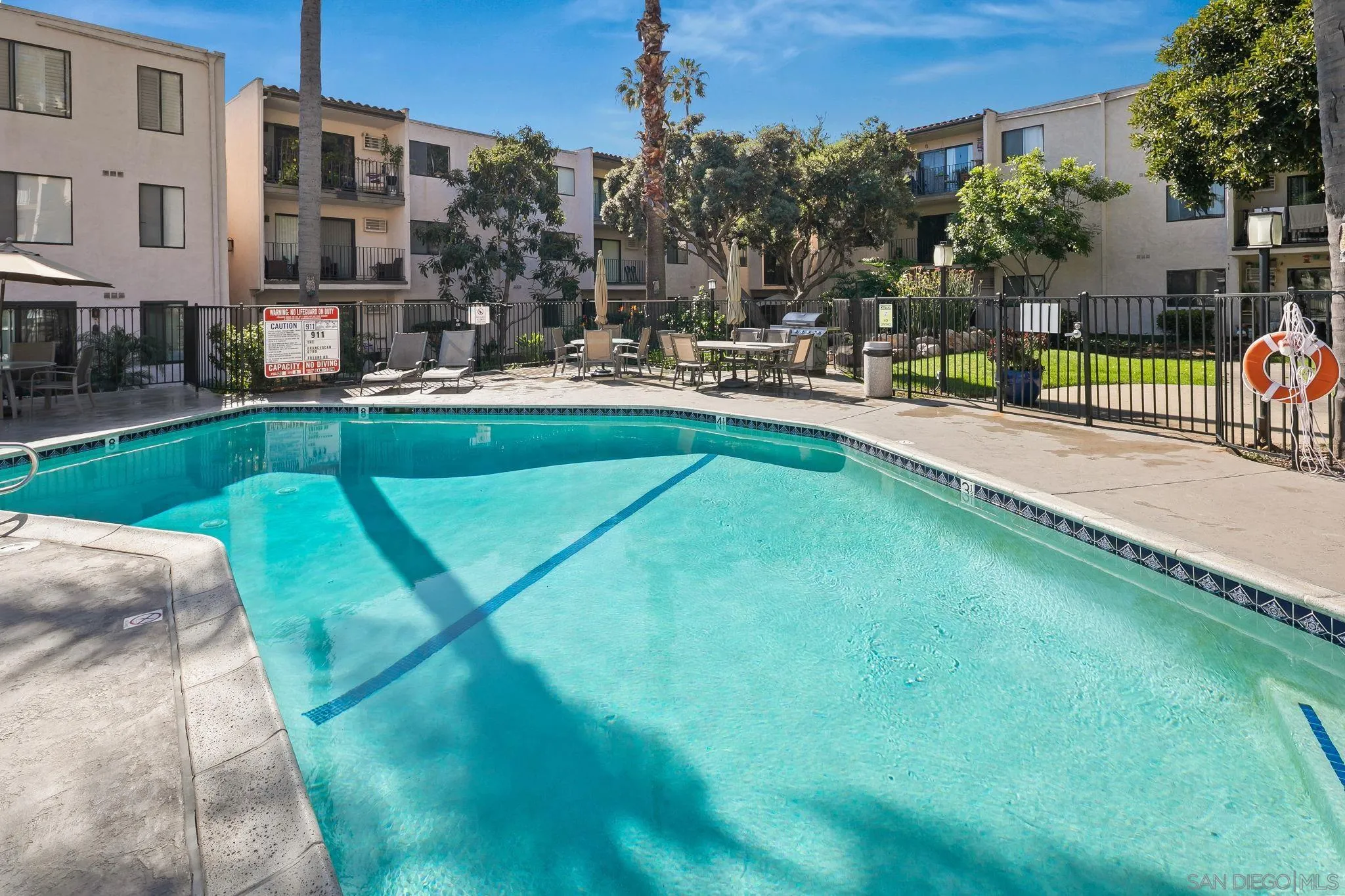 6780 Friars Road, Unit 272 San Diego, CA 92108 - Photo 20 of 35 a swimming pool with outdoor seating and yard