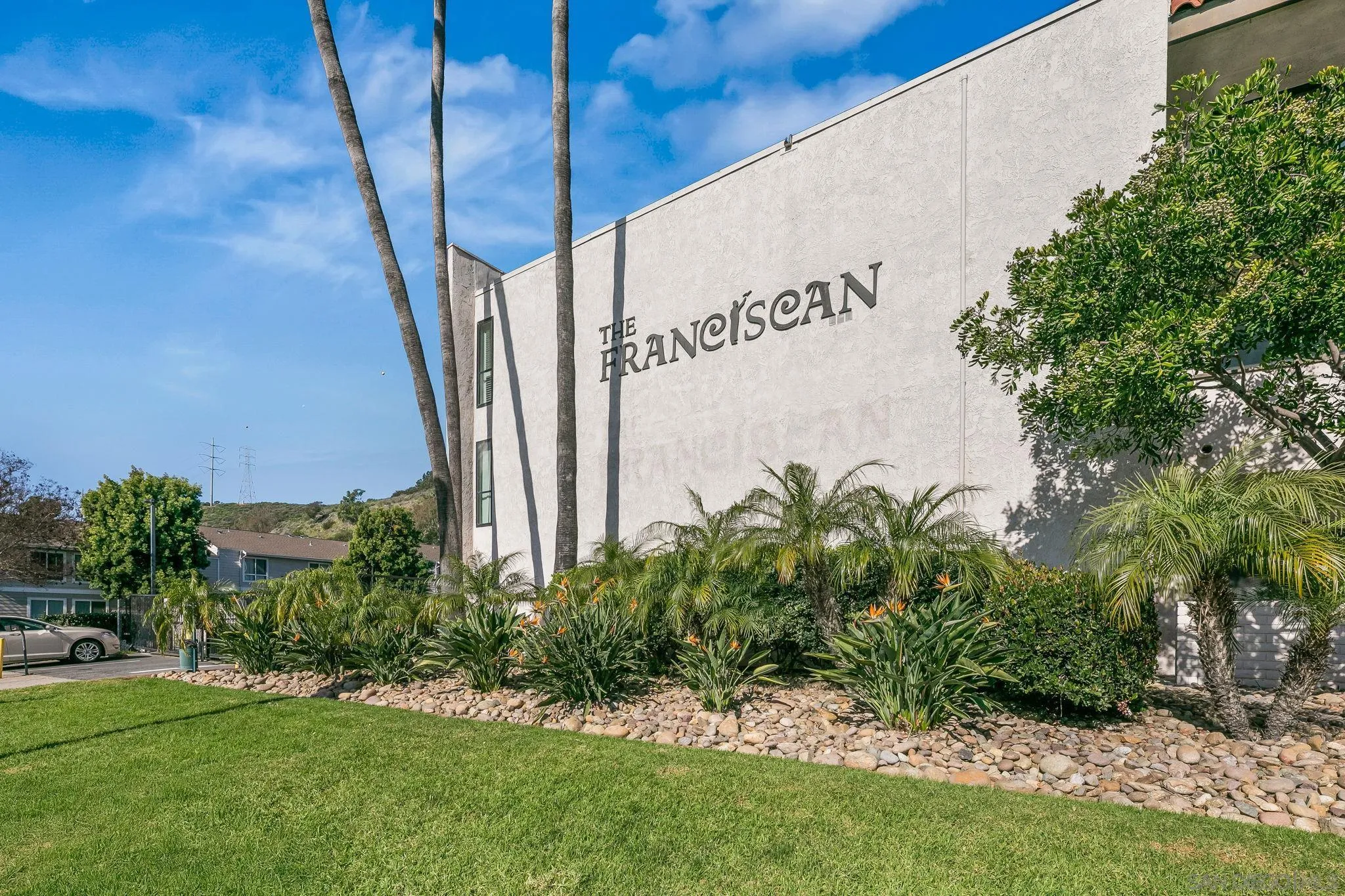 6780 Friars Road, Unit 272 San Diego, CA 92108 - Photo 34 of 35 a view of a sign in a yard with potted plants