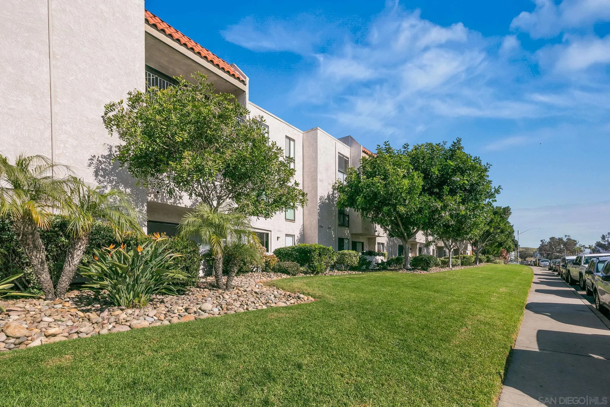 6780 Friars Road, Unit 272 San Diego, CA 92108 - Photo 35 of 35 a view of a garden with a building in the background