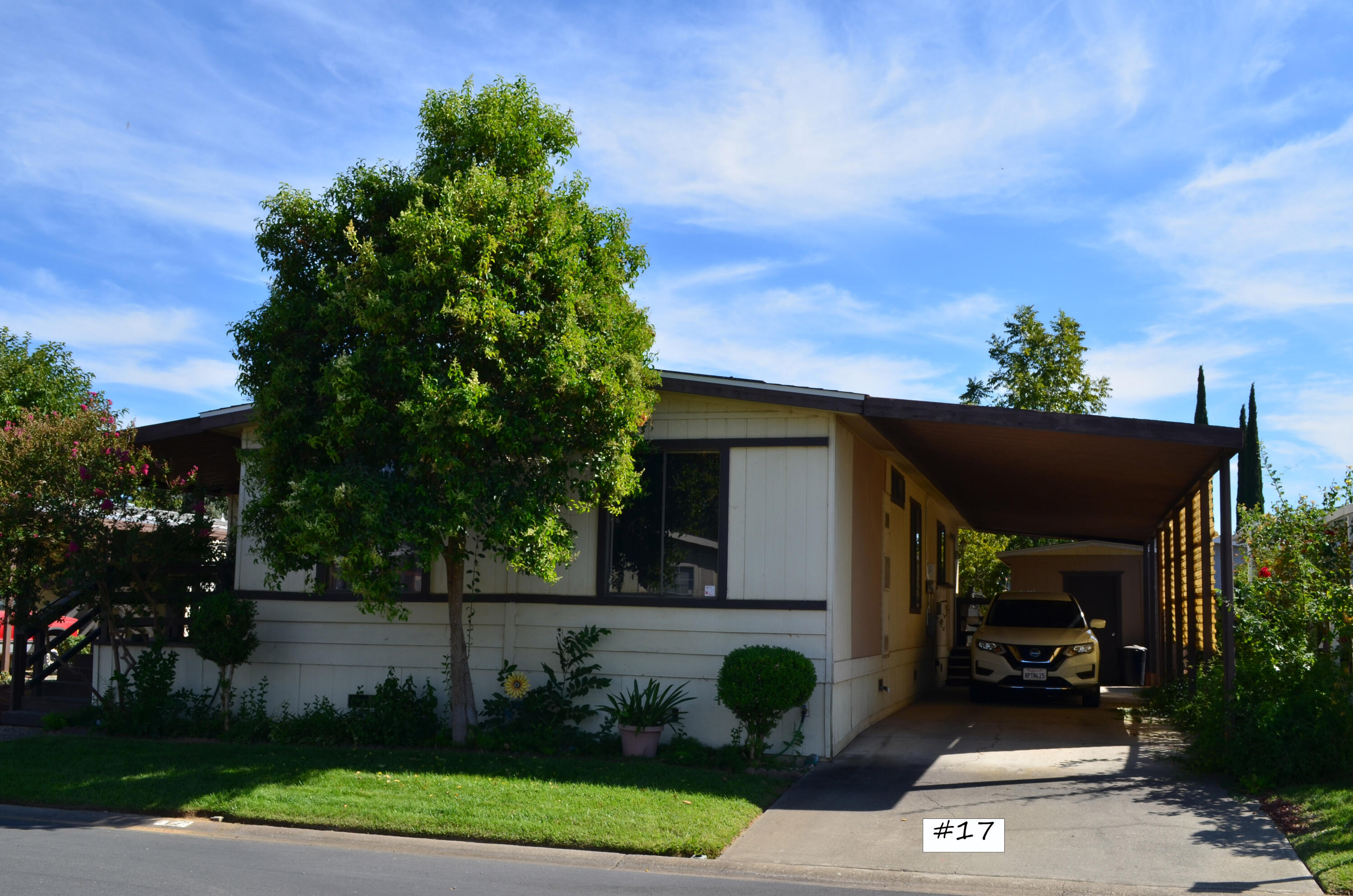 a view of a car park in front of house