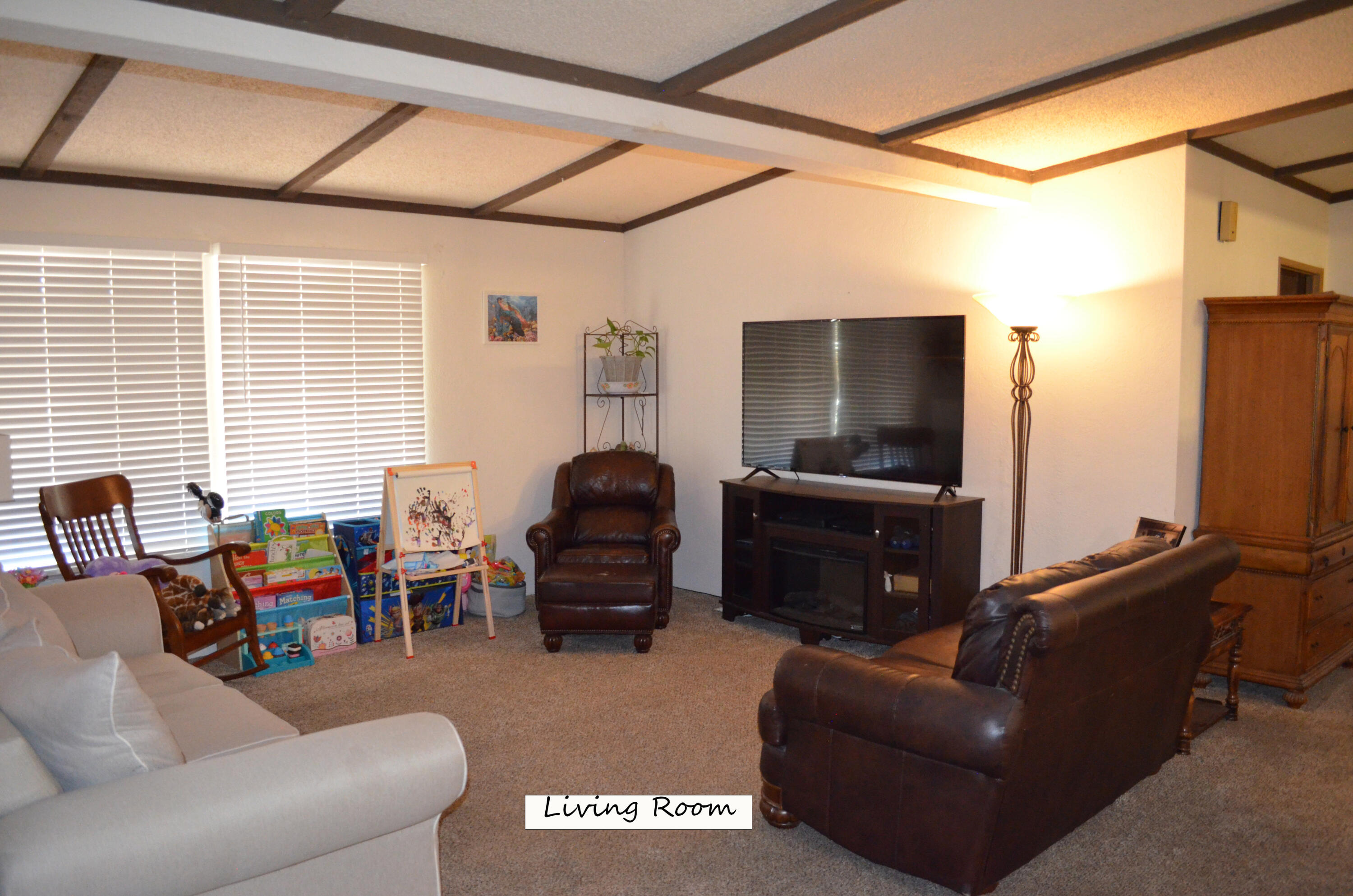 3835 Gardiner Ferry Road, Unit 17 Corning, CA 96021 - Photo 12 of 39 a living room with furniture and a flat screen tv