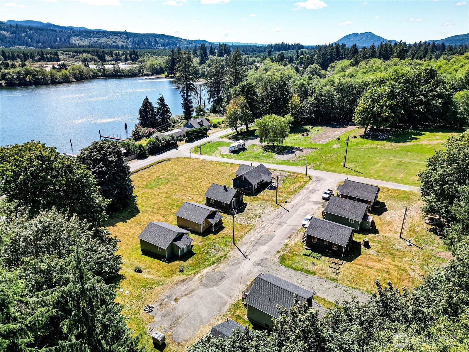 an aerial view of a house with outdoor space swimming pool and lake view