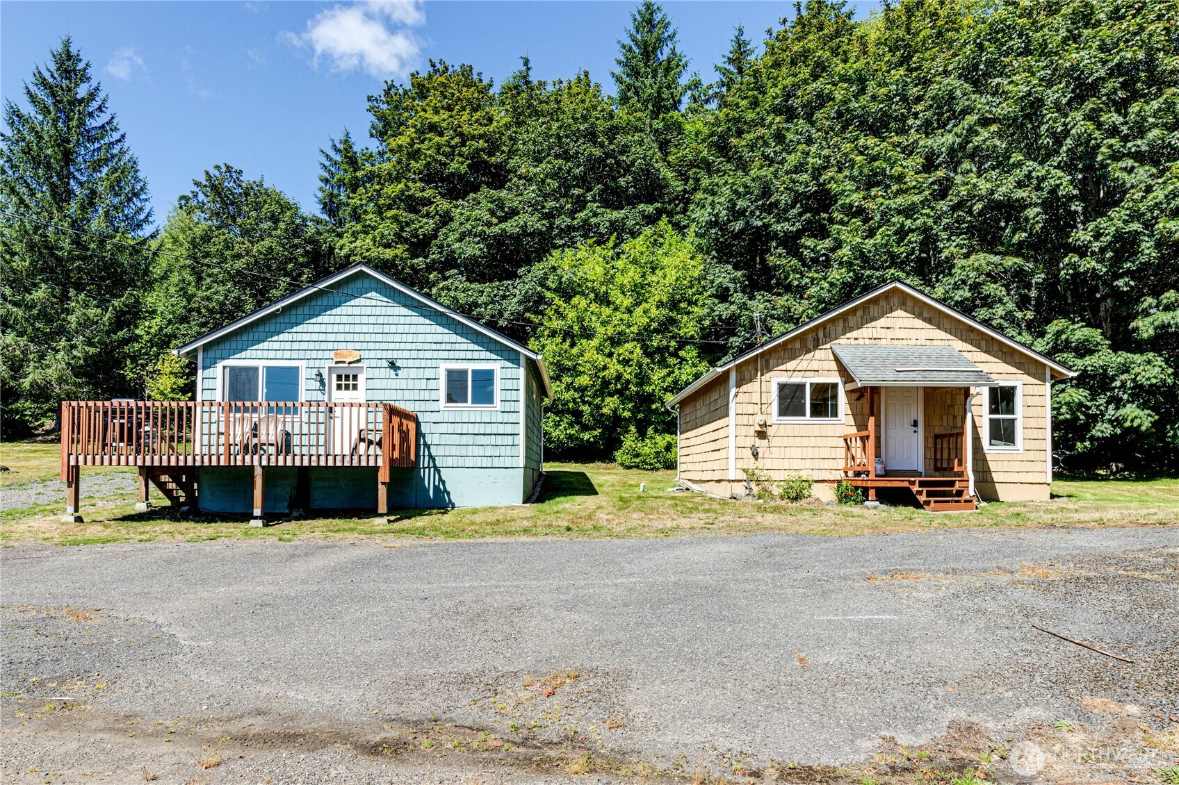 20 Smithville Road Beaver, WA 98305 - Photo 16 of 40 a view of a house with a yard and large trees