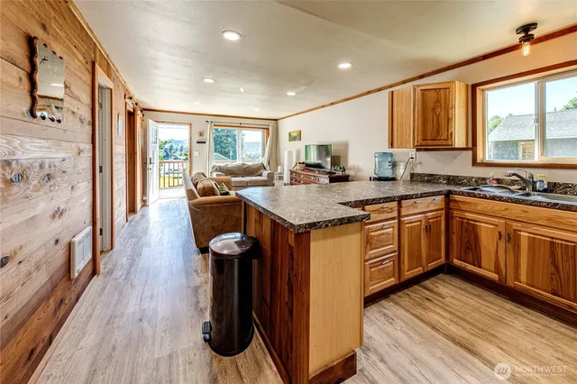a kitchen with a sink stove and cabinets