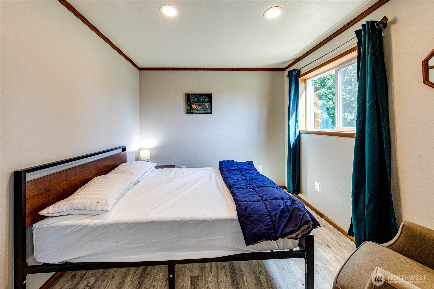 20 Smithville Road Beaver, WA 98305 - Photo 21 of 40 a bed sitting in a bedroom next to a window