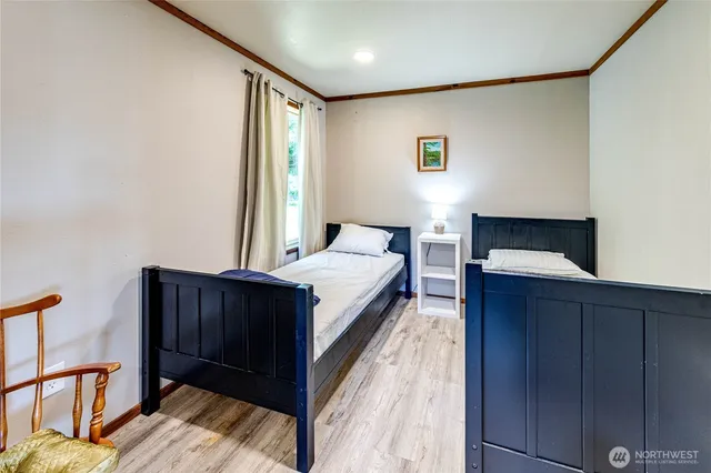 a bed room with a bed and a dresser