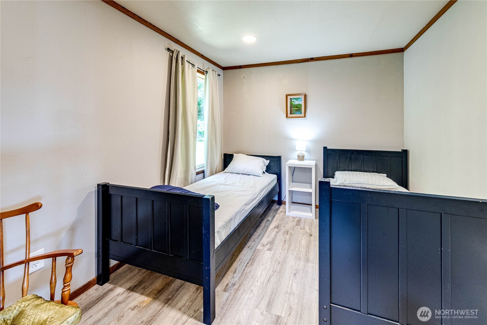 20 Smithville Road Beaver, WA 98305 - Photo 22 of 40 a bed room with a bed and a dresser