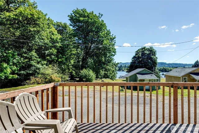 a view of balcony with wooden floor