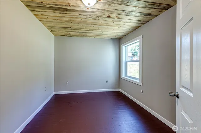 an empty room with wooden floor