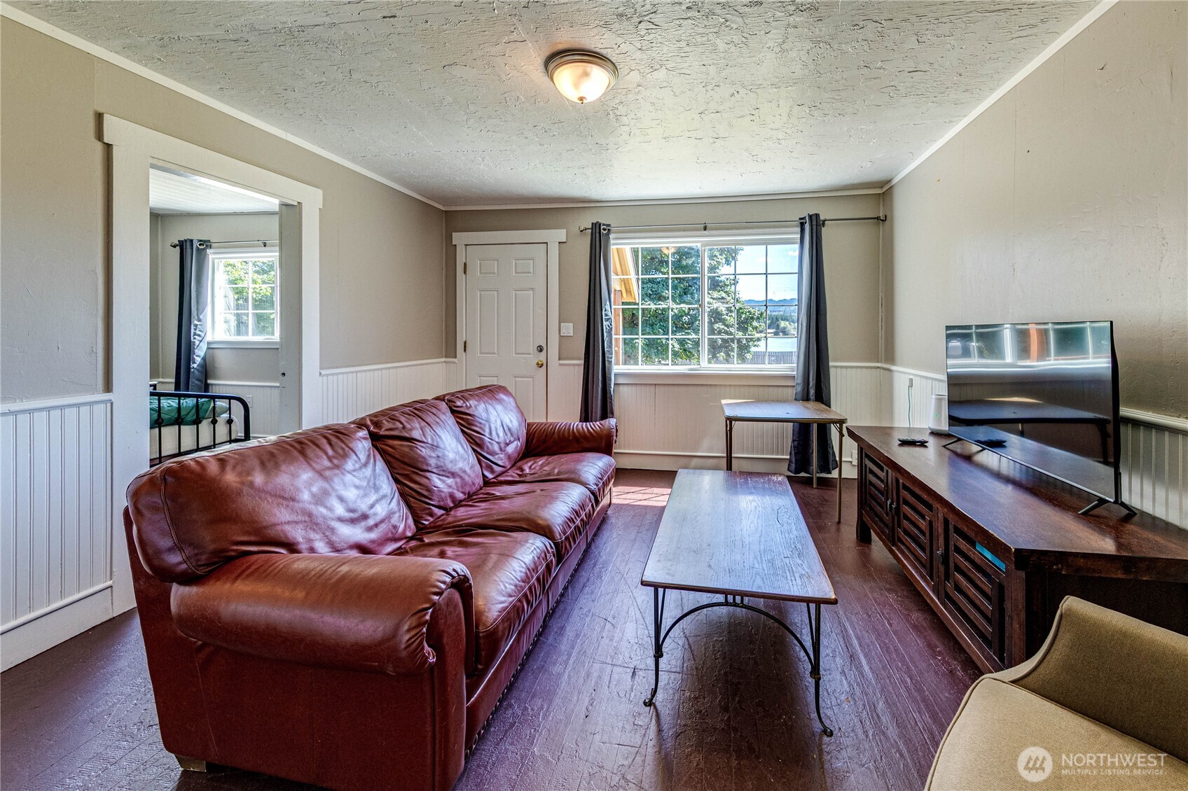20 Smithville Road Beaver, WA 98305 - Photo 31 of 40 a living room with furniture and a flat screen tv