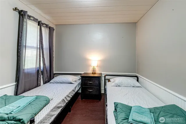 a bedroom with a bed and window