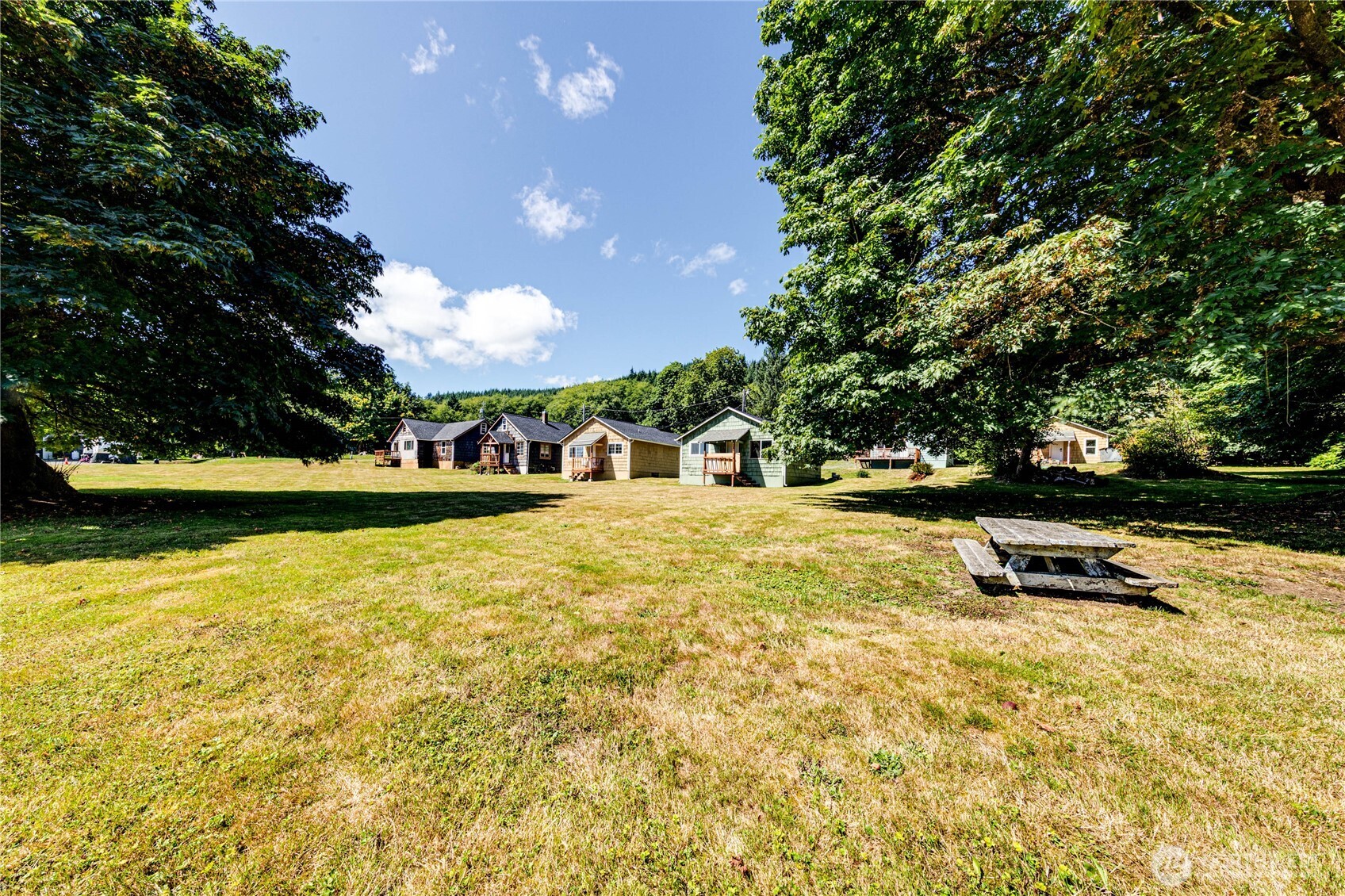 20 Smithville Road Beaver, WA 98305 - Photo 34 of 40 a view of a swimming pool with an outdoor seating and a yard