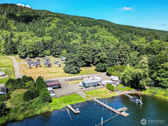 an aerial view of a house with a yard