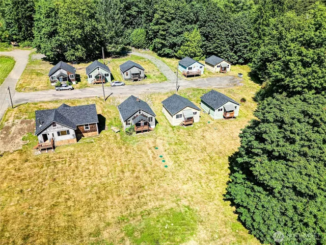 a view of backyard with swimming pool