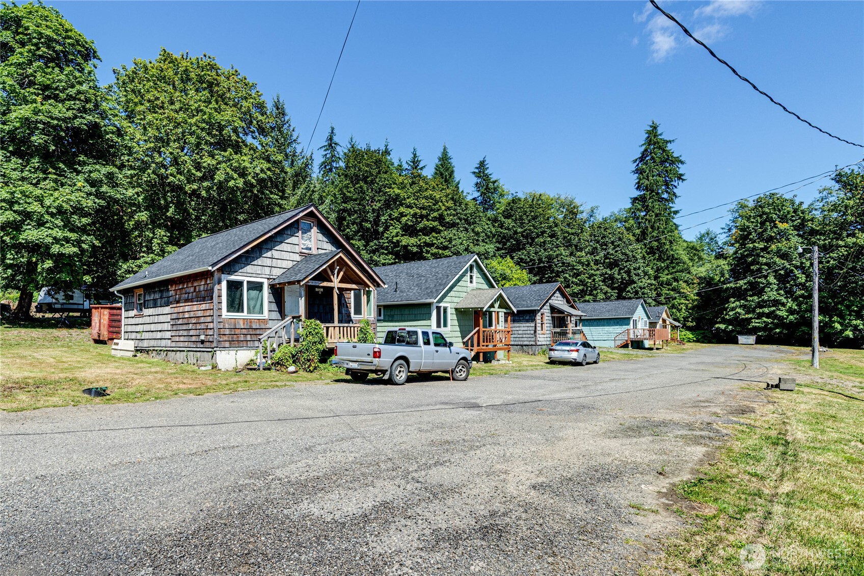 20 Smithville Road Beaver, WA 98305 - Photo 6 of 40 a view of a house with large trees and yard