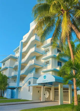 a front view of a multi story residential apartment building with entryway