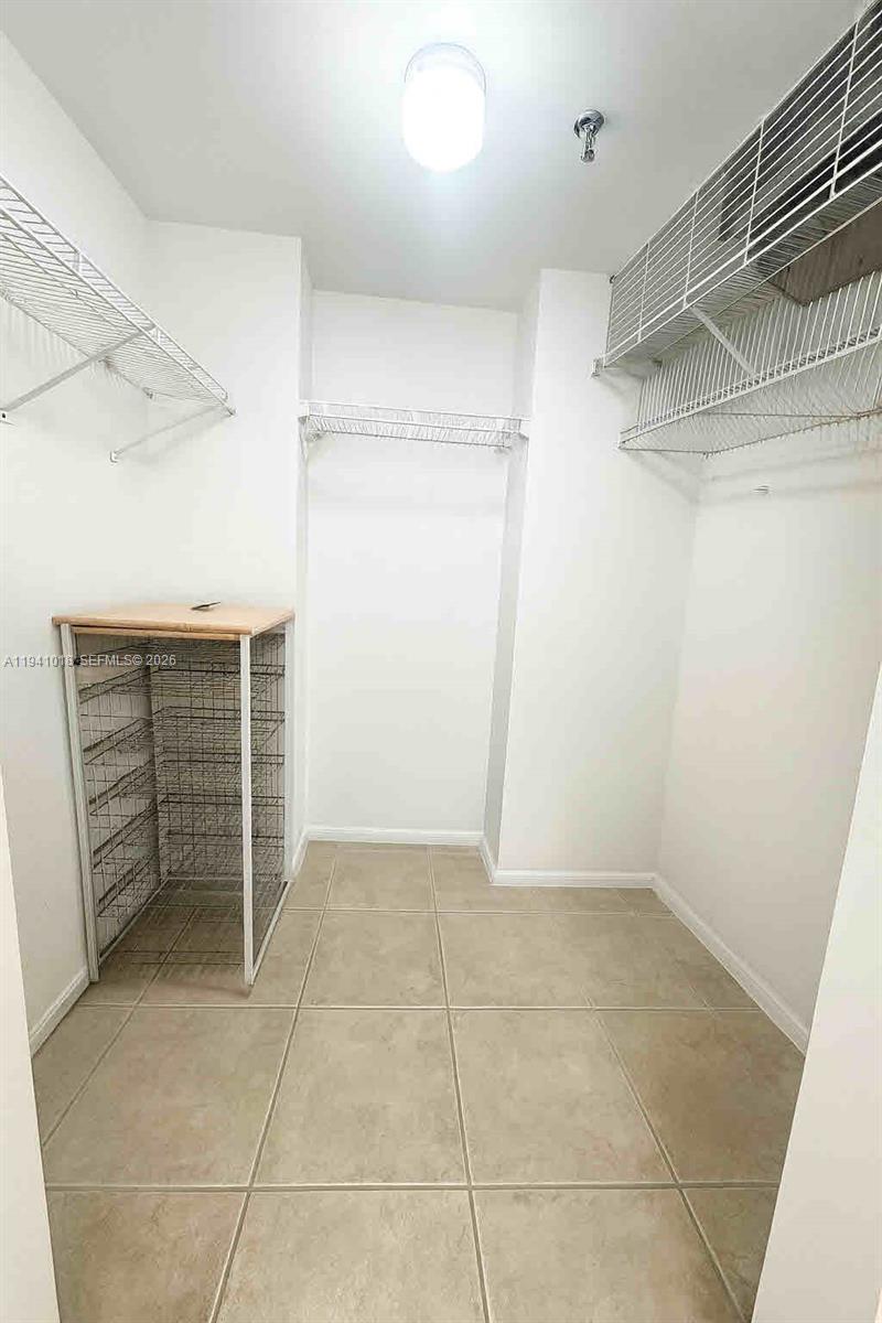 9156 Collins Avenue, Unit 302 Surfside, FL 33154 - Photo 10 of 19 Walking Closet