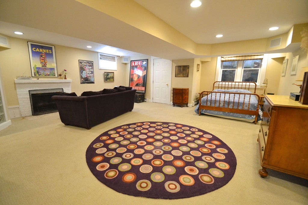 53 Arapahoe Road Newton, MA 02465 - Photo 20 of 25 a living room with furniture and a wooden floor