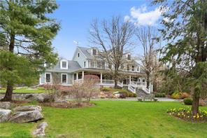 6 Sniffen Road Armonk, NY 10504 - Photo 1 of 1 a front view of a house with yard and green space