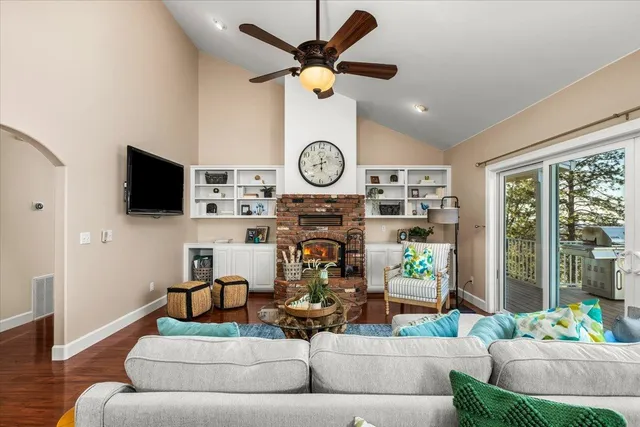 a kitchen sink with a granite countertop window and sink
