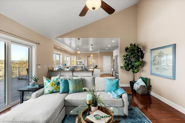 a kitchen with stainless steel appliances granite countertop a sink a stove and a refrigerator