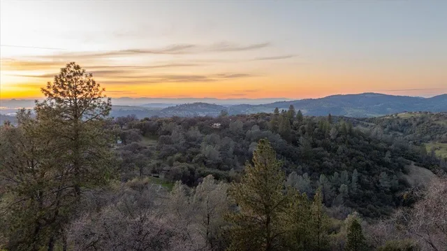a view of a livingroom with furniture and windows