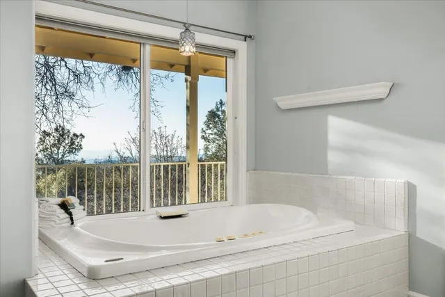 a bathroom with a sink a mirror and a shower