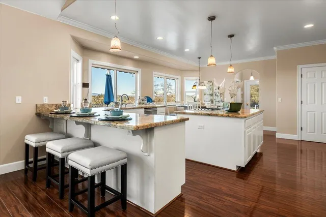 a view of a deck with mountain view and wooden floor