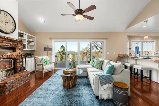a view of living room filled with furniture and wooden floor