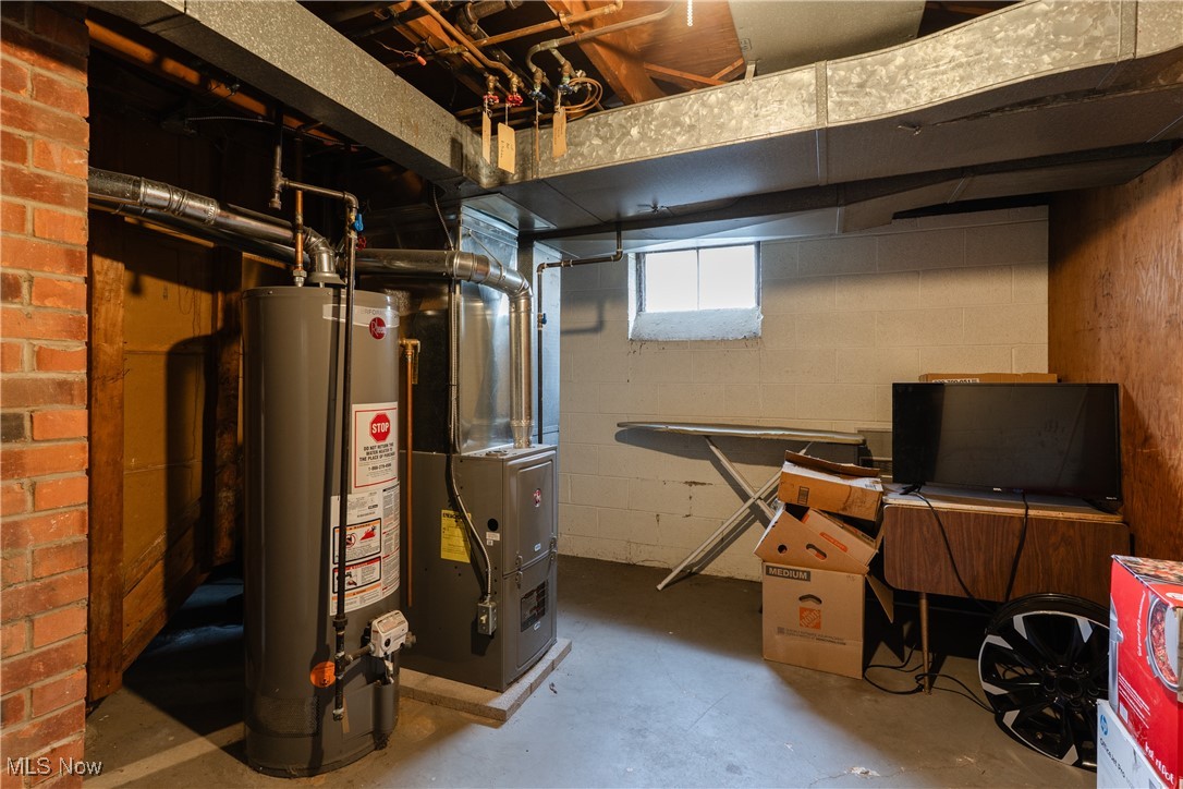 14220 Triskett Road Cleveland, OH 44111 - Photo 32 of 32 Below grade area with gas water heater and heating unit