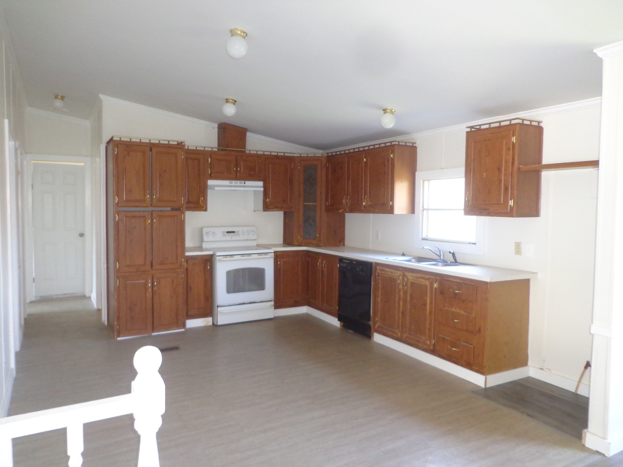 152 Baker Ridge Road Waverly, TN 37185 - Photo 11 of 20 a kitchen with cabinets a sink and a stove
