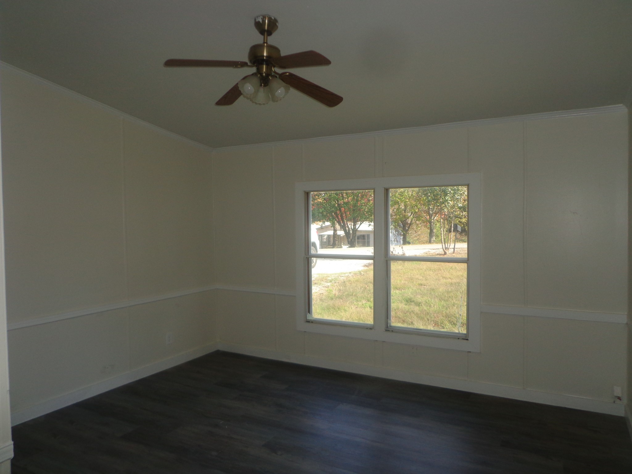 152 Baker Ridge Road Waverly, TN 37185 - Photo 14 of 20 en empty room with wooden floor and windows