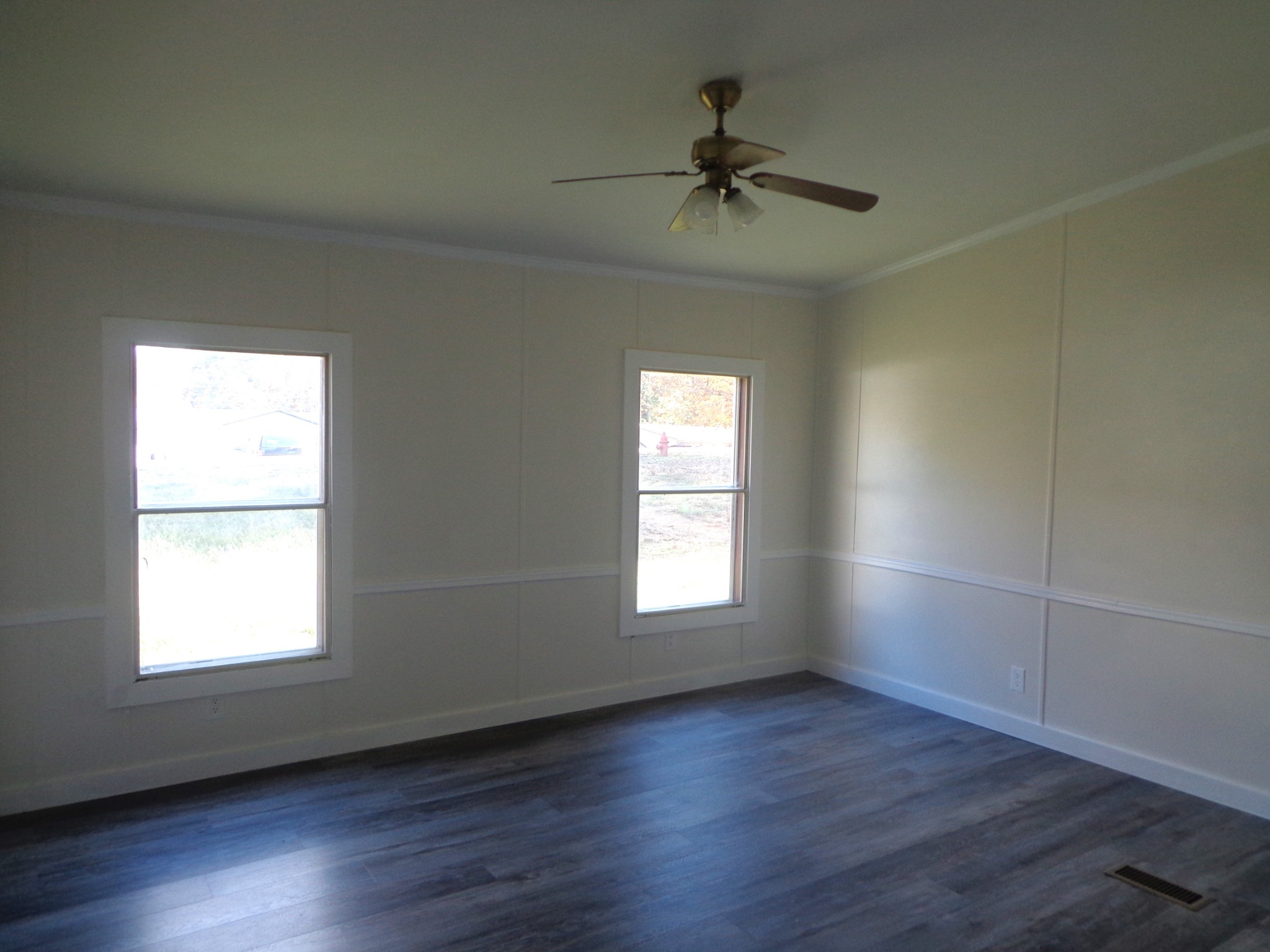 152 Baker Ridge Road Waverly, TN 37185 - Photo 15 of 20 a view of empty room with wooden floor and fan