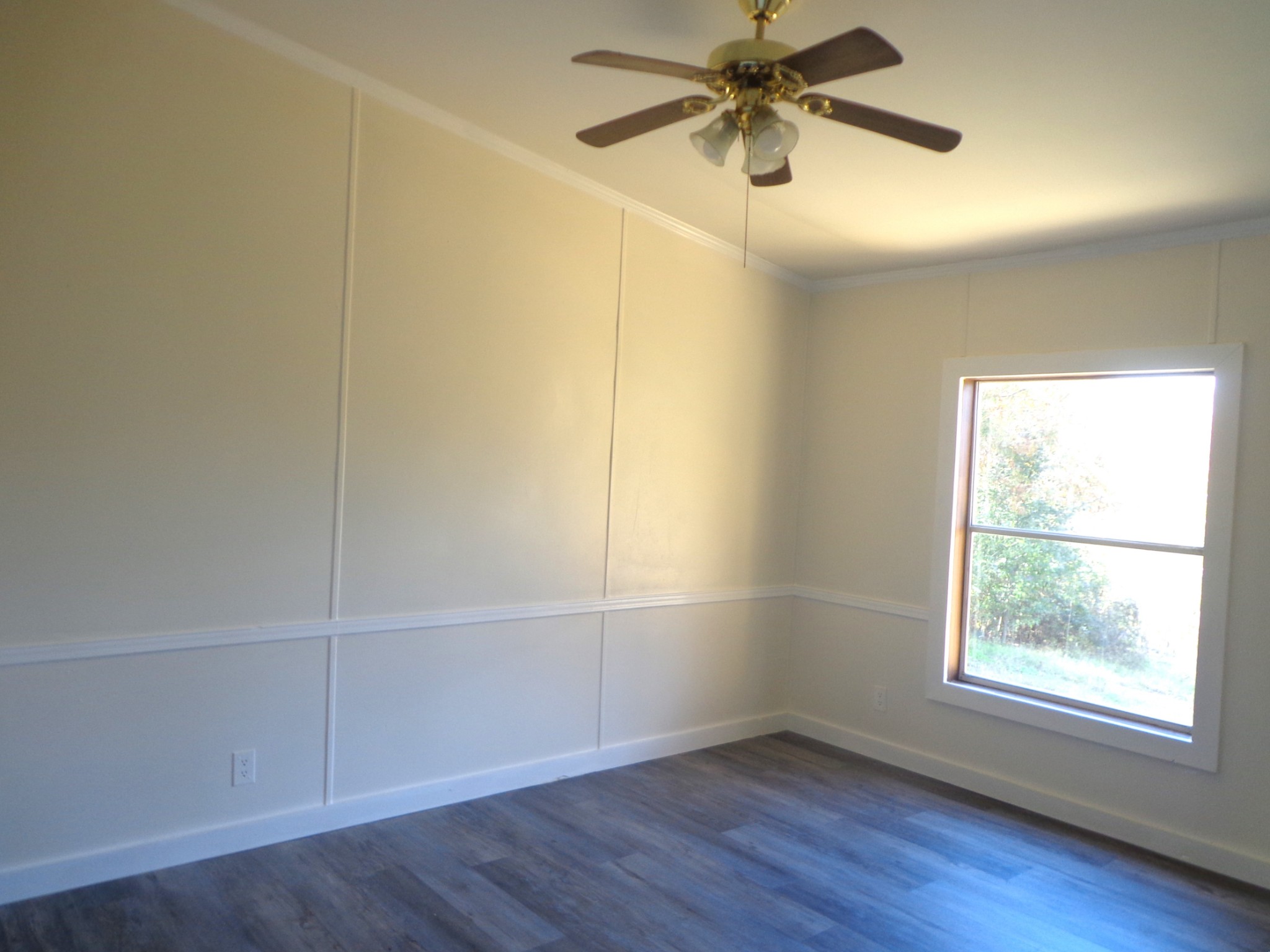 152 Baker Ridge Road Waverly, TN 37185 - Photo 16 of 20 an empty room with wooden floor closet and windows