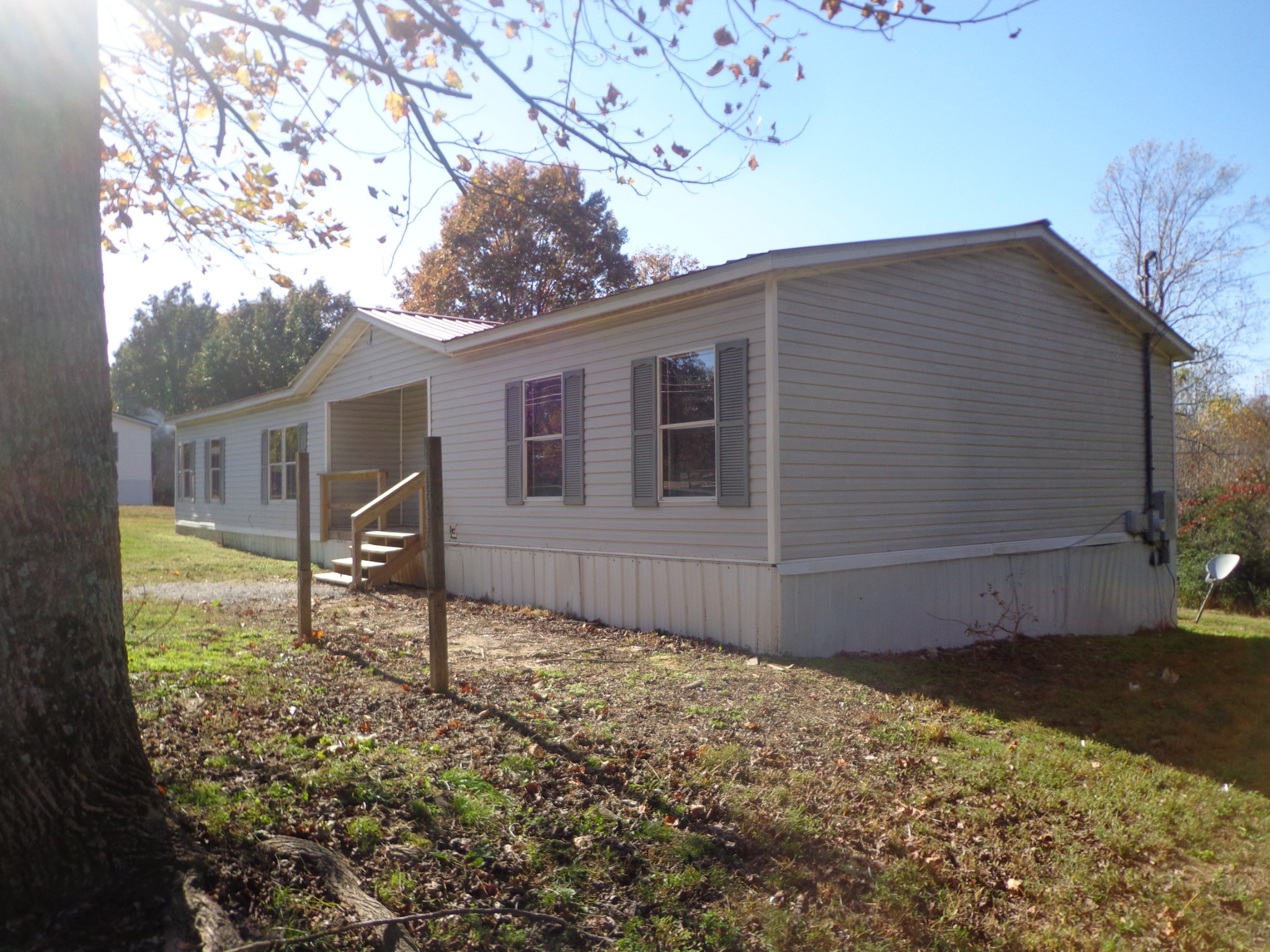 152 Baker Ridge Road Waverly, TN 37185 - Photo 20 of 20 a backyard of a house with table and chairs