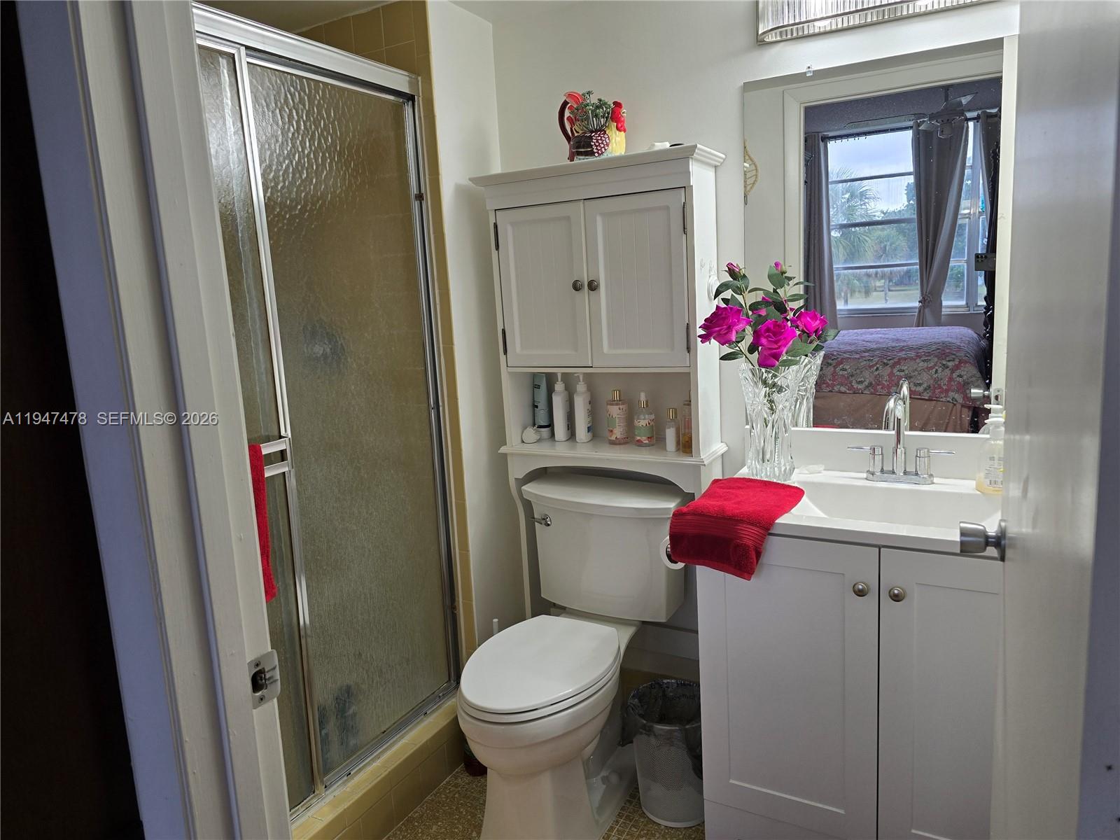7690 Northwest 18th Street, Unit 306 Margate, FL 33063 - Photo 14 of 30 a bathroom with a toilet and a sink