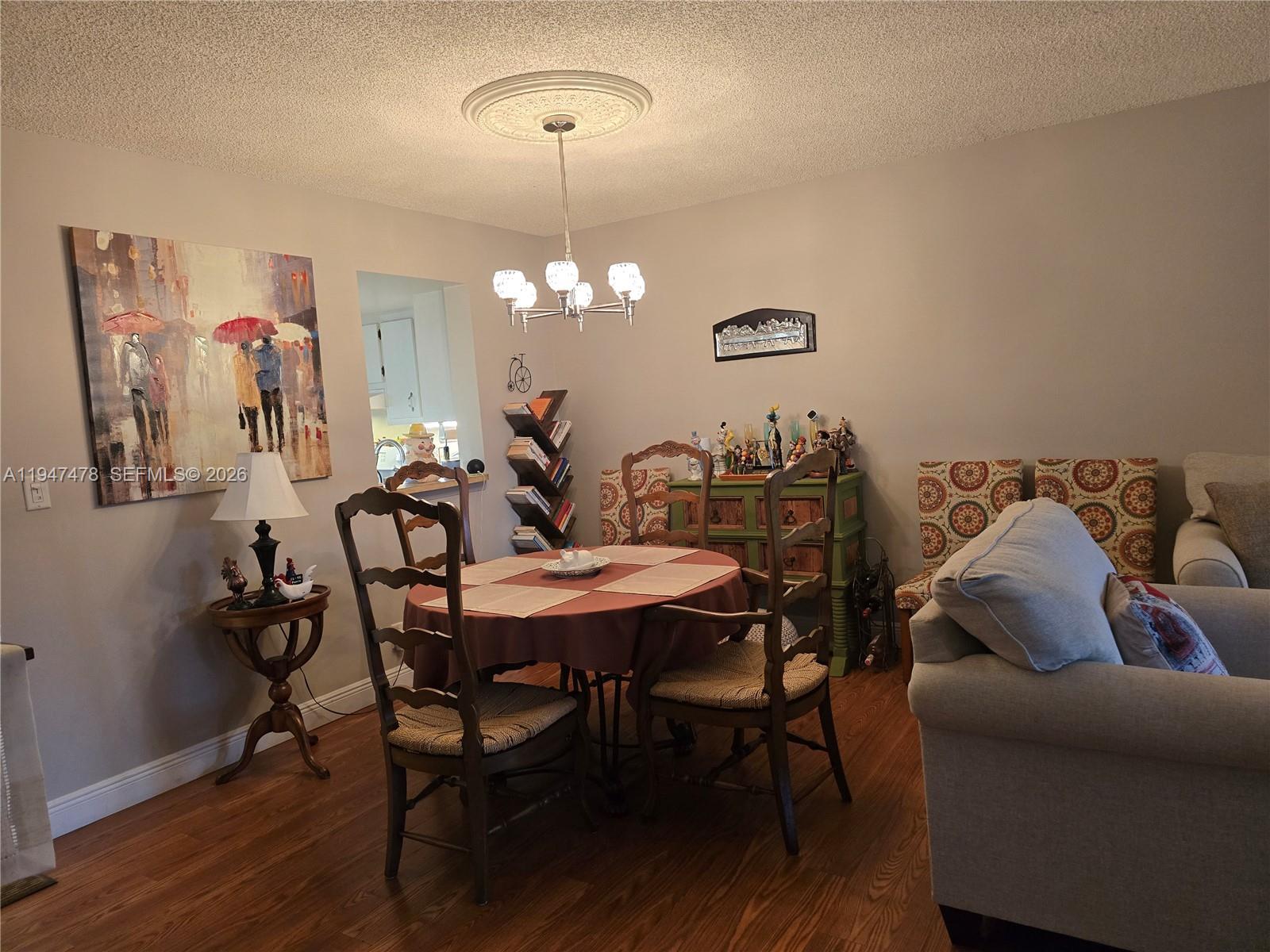 7690 Northwest 18th Street, Unit 306 Margate, FL 33063 - Photo 4 of 30 a view of a dining room with furniture and wooden floor