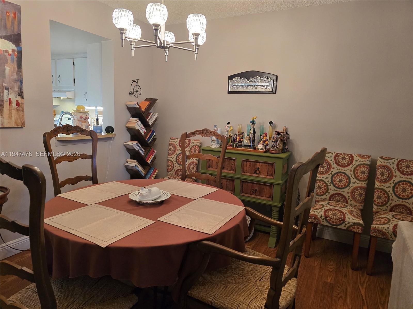 7690 Northwest 18th Street, Unit 306 Margate, FL 33063 - Photo 5 of 30 a view of a dining room with furniture and wooden floor