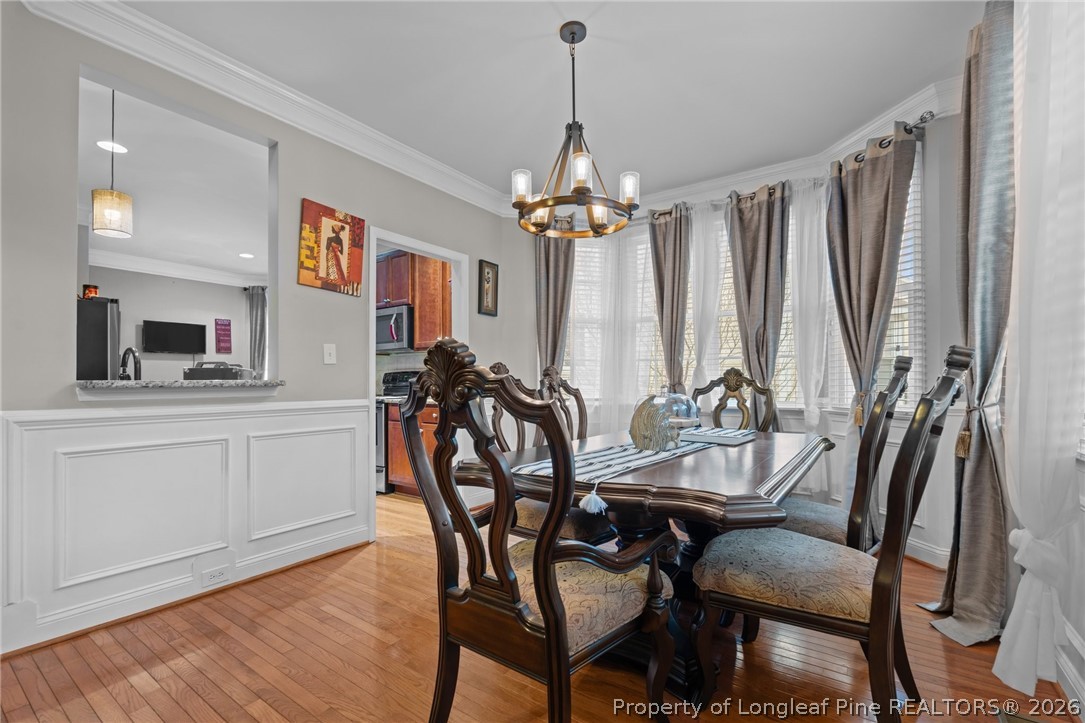 55 London Way Spring Lake, NC 28390 - Photo 20 of 43 a view of a dining room with furniture and chandelier