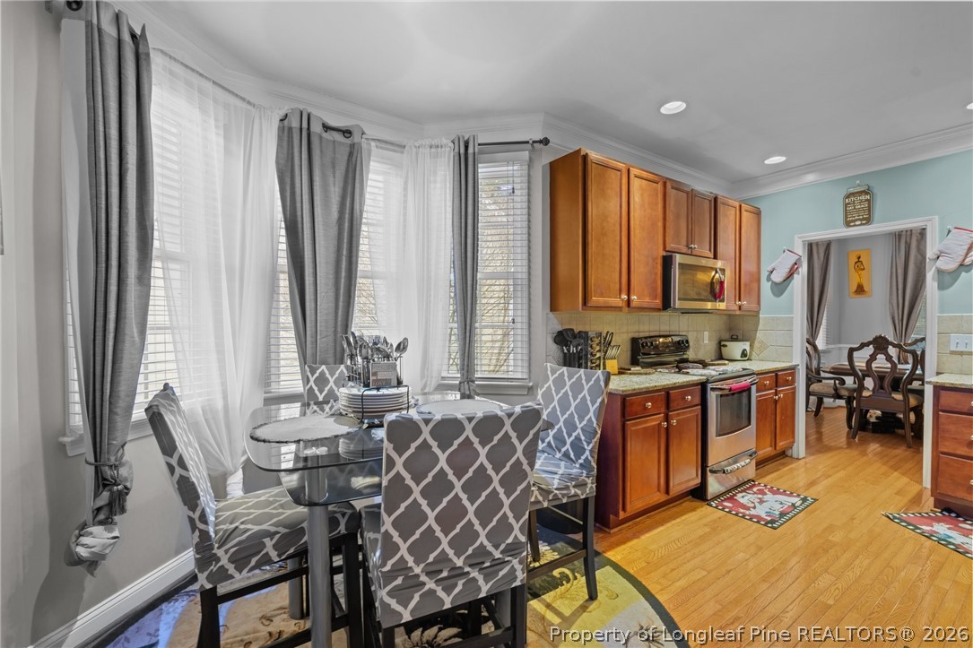 55 London Way Spring Lake, NC 28390 - Photo 26 of 43 a view of a dining room with furniture window and outside view