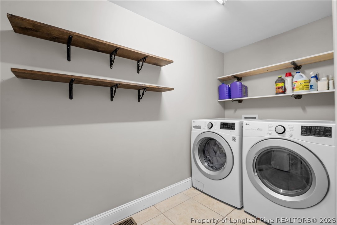 55 London Way Spring Lake, NC 28390 - Photo 28 of 43 a utility room with dryer and washer