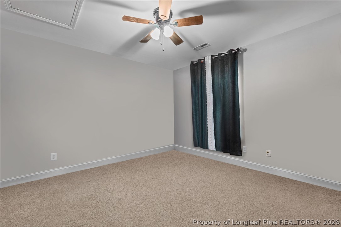 55 London Way Spring Lake, NC 28390 - Photo 33 of 43 an empty room with windows and fan