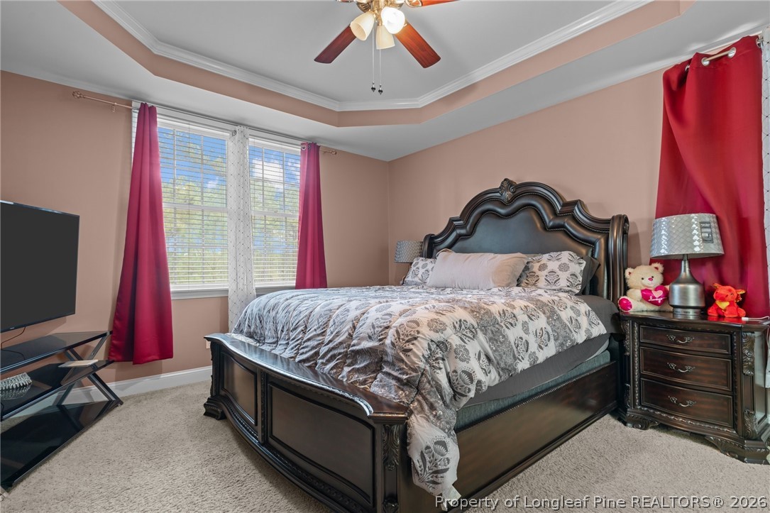 55 London Way Spring Lake, NC 28390 - Photo 7 of 43 a bedroom with a bed and a flat tv screen
