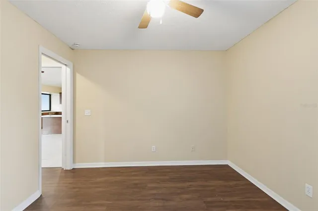 a view of a room with wooden floor