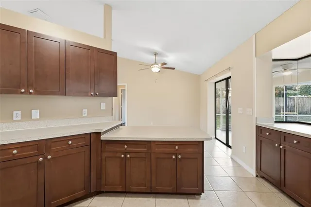a spacious bathroom with a sink and a mirror